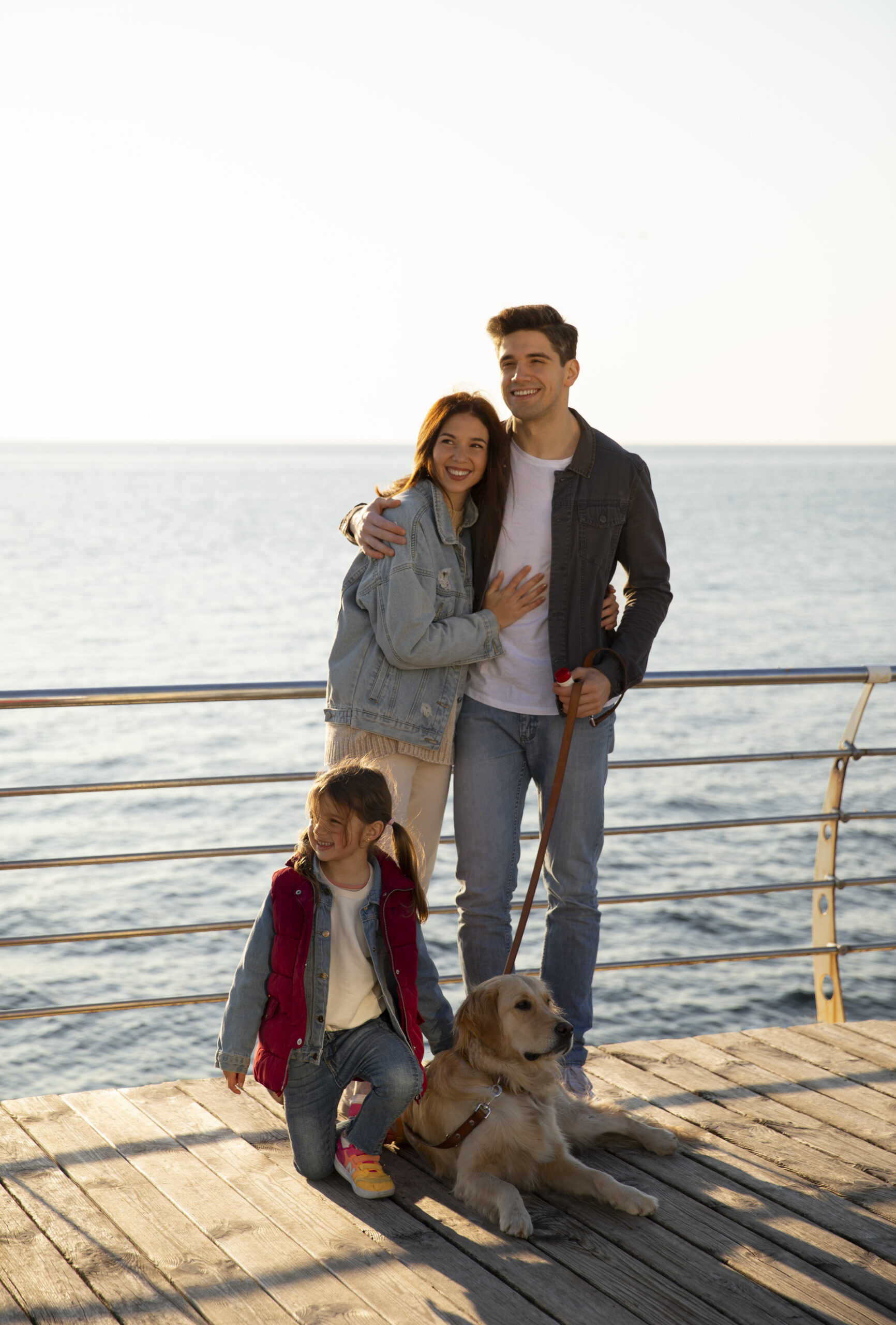 full shot family hanging out jetty scaled